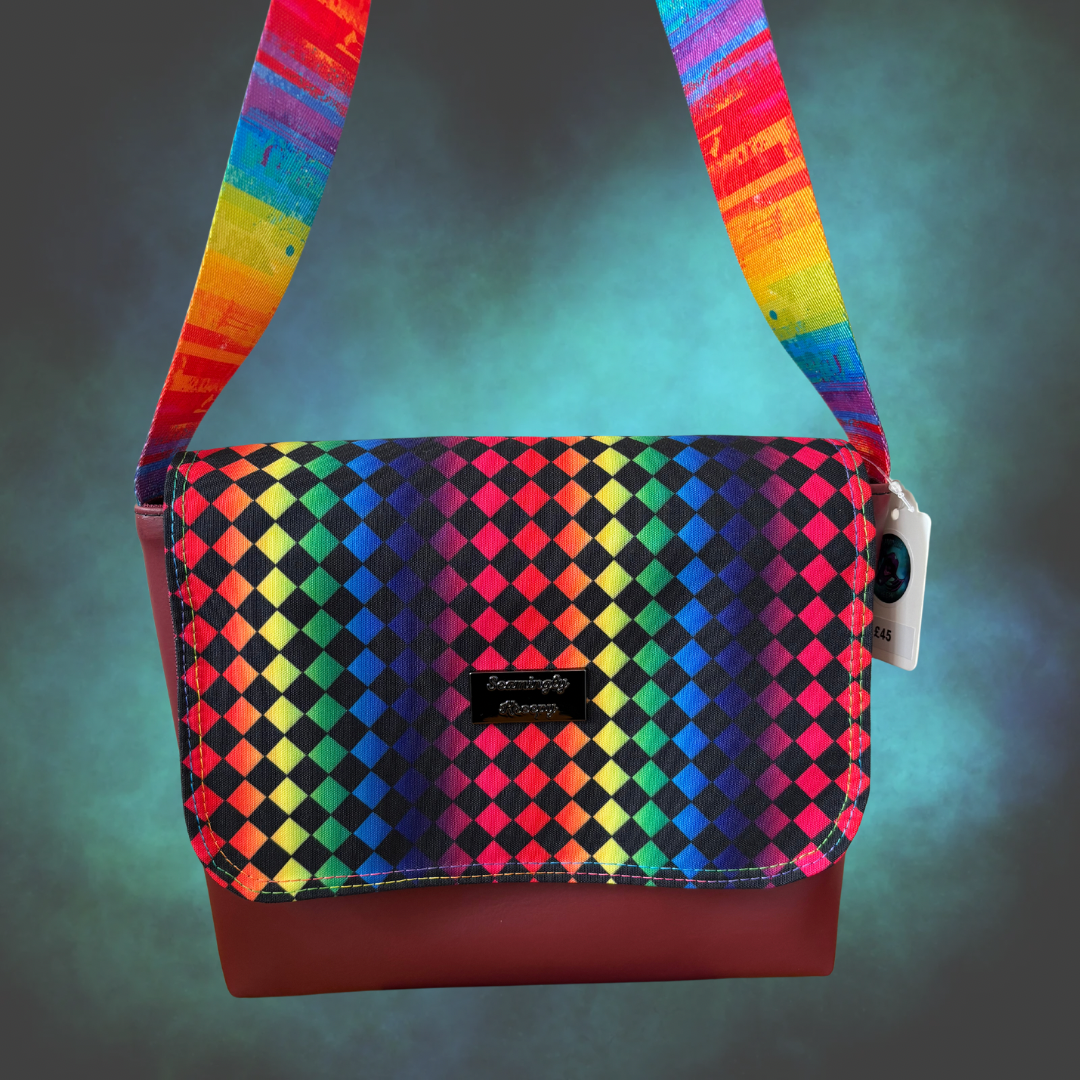 Rainbow Harlequin print messenger bag